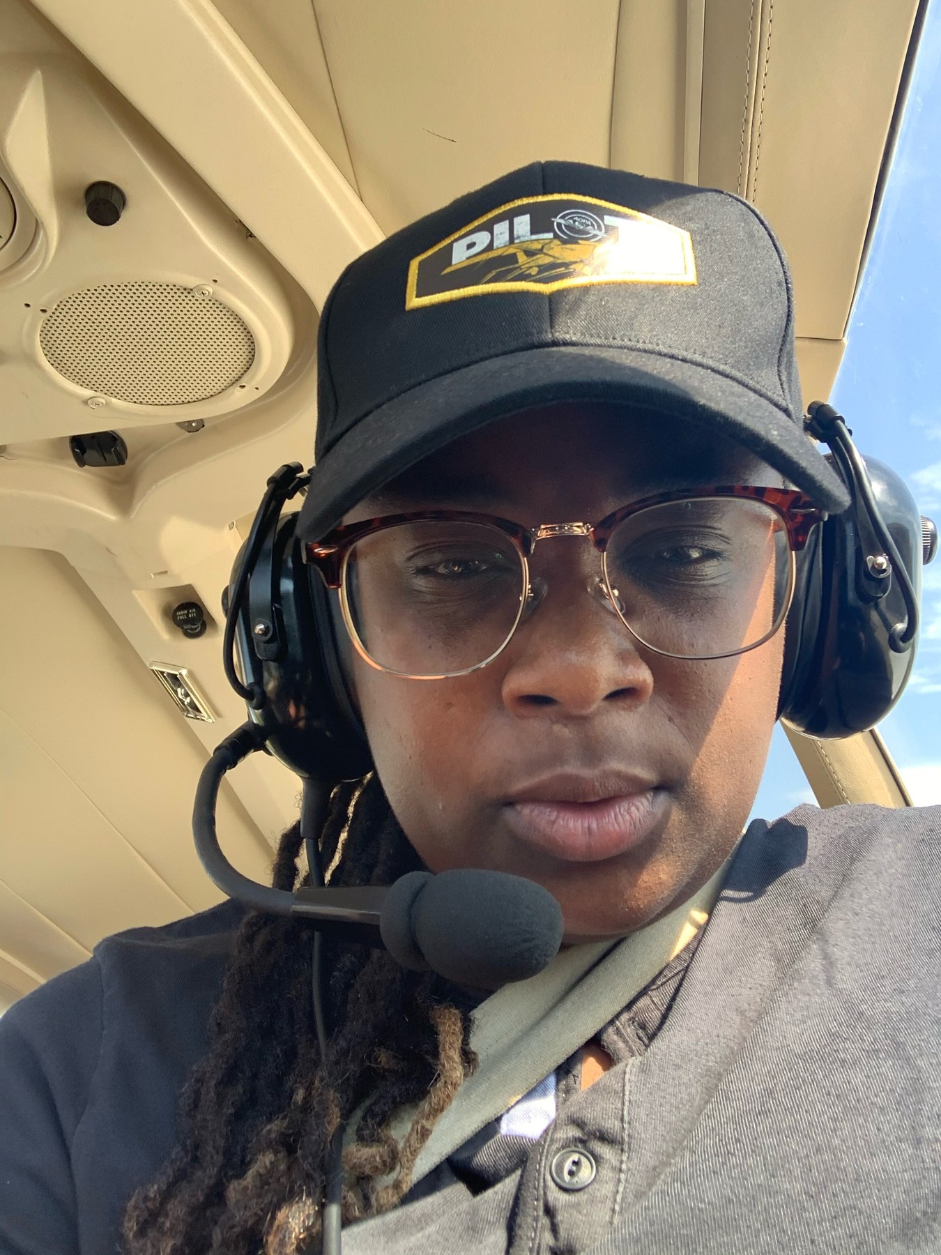 S. Crump in the flight deck wearing aviation headset